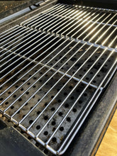 Load image into Gallery viewer, Two Que-Tensils Stainless Steel Half Grill Plates sitting in the Oklahoma Joe Rambler barbecue.